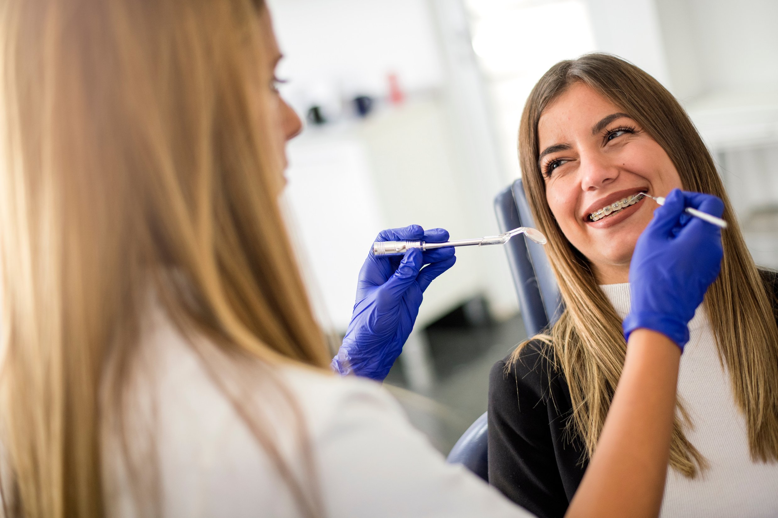 Young happy  patient a with orthodontic braces